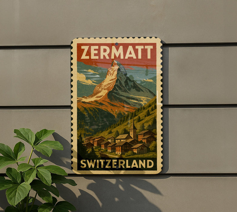 A vintage-style poster of the Matterhorn mountain in Switzerland, featuring a small village below the mountain.