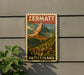 A vintage-style poster of the Matterhorn mountain in Switzerland, featuring a small village below the mountain.