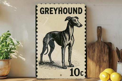 A greyhound dog illustration on a 10 cent postage stamp, placed on a wooden surface next to a wooden cutting board and some lemons.