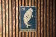 A postage stamp featuring a beluga whale, with the number 20 visible.
