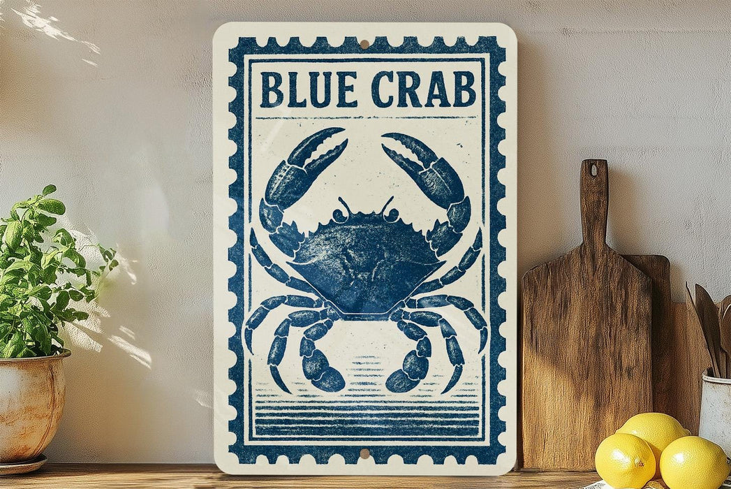 a blue crab on a white sign with a decorative border, placed on a wooden surface next to a wooden cutting board and some lemons.