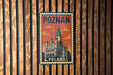 A vintage-style metal stamp depicting the Poznan Castle in Poland, with the text "POLAND" printed on it.