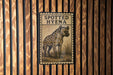 a sign with the text "SPOTTED HYENA" and an illustration of a spotted hyena.