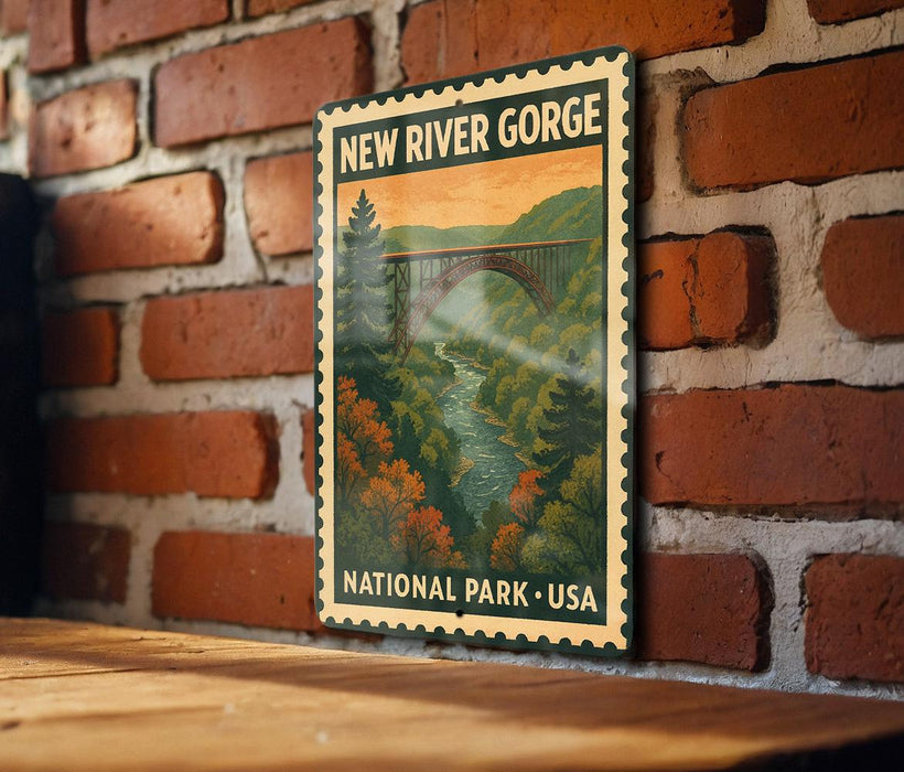A vintage-style metal sign for New River Gorge National Park, featuring a scenic illustration of a river and bridge surrounded by autumn foliage.