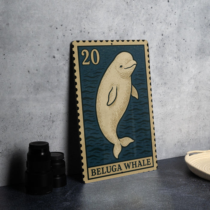 A metal stamp featuring a beluga whale, with the number 20 printed on it, is displayed on a table next to some black camera lenses.