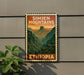 A vintage-style postage stamp depicting Simien Mountains in Ethiopia, with a lush green landscape and a warm, orange sky.
