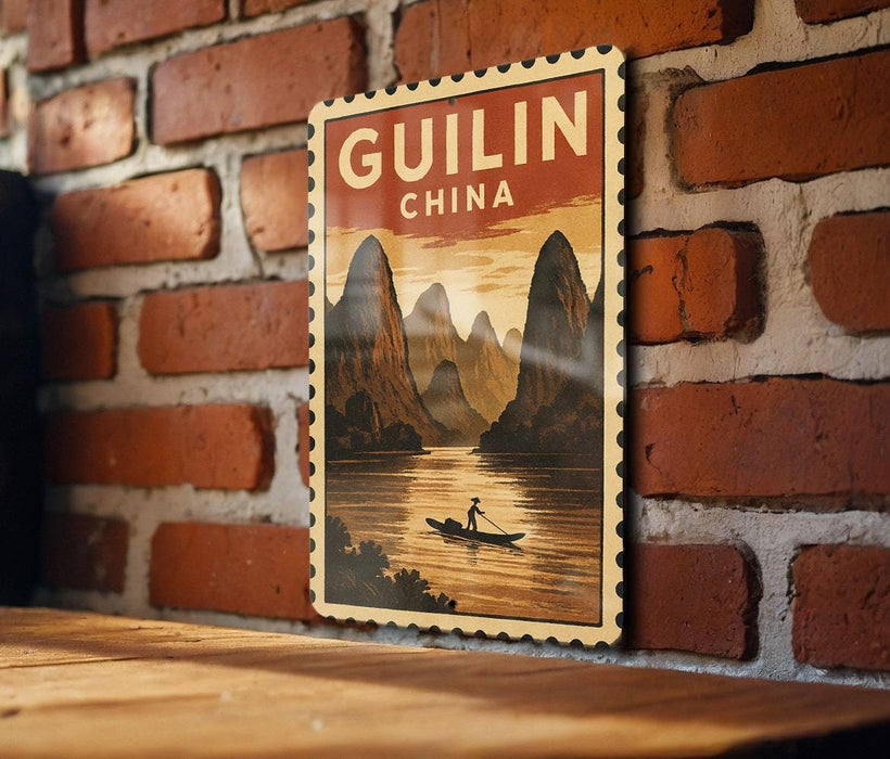 A vintage-style poster of Guilin, China, featuring a person rowing a boat on a river surrounded by mountains.