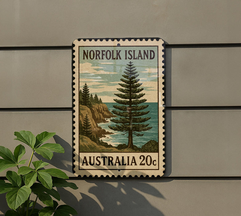 a postage stamp from Norfolk Island, Australia, with a pine tree and a coastal landscape.