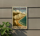 A vintage-style postage stamp depicting the White Cliffs of Dover, a famous landmark in England.