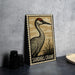 A metal sign featuring an illustration of a sandhill crane, with the text "Sandhill Crane" printed on it.