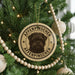 A Christmas tree decorated with ornaments, including a circular ornament with a dog image and the text "Affenpinscher" on it.