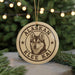 A circular ornament featuring a close-up of a husky dog's face, with the text "ALASKAN KLEE KAI" around the edge.