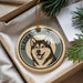 A circular ornament featuring a close-up image of a husky dog, with the text "Alaska Malamute" printed on it.