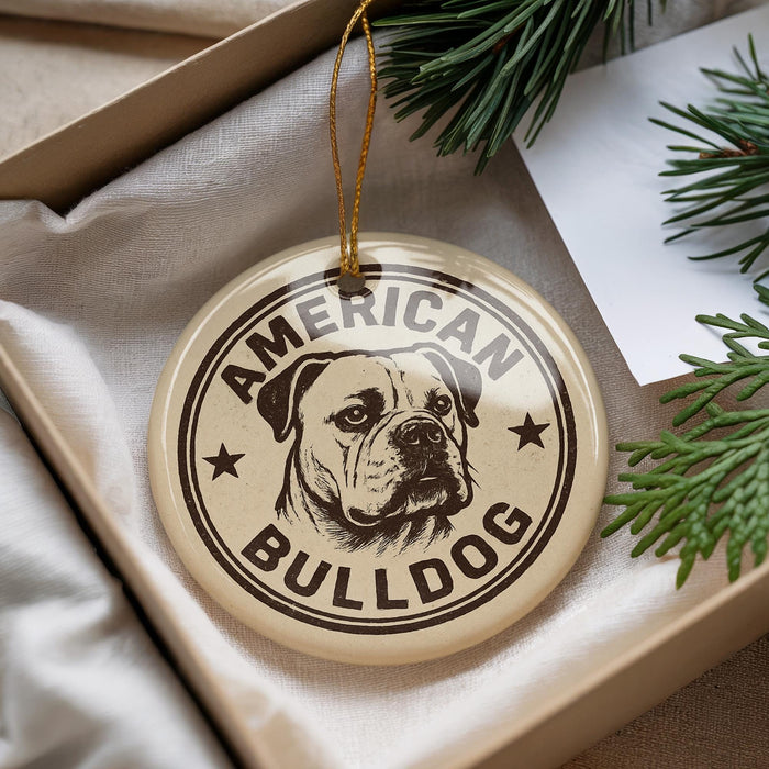 A circular ornament with the text "AMERICAN BULLDOG" printed on it, featuring a bulldog illustration.
