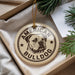 A circular ornament with the text "AMERICAN BULLDOG" printed on it, featuring a bulldog illustration.