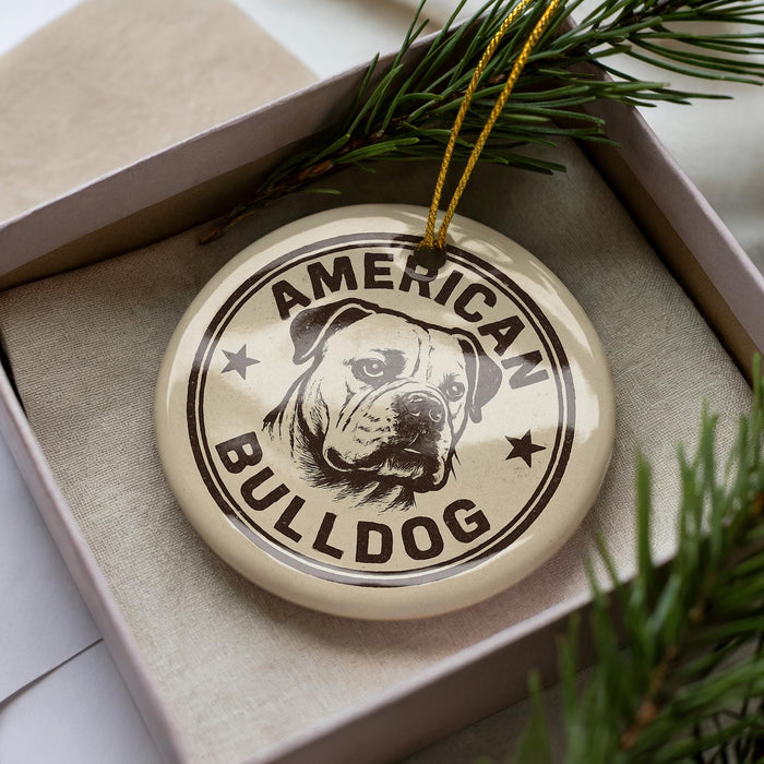 A circular ornament with the text "AMERICAN BULLDOG" printed on it, surrounded by a decorative border.