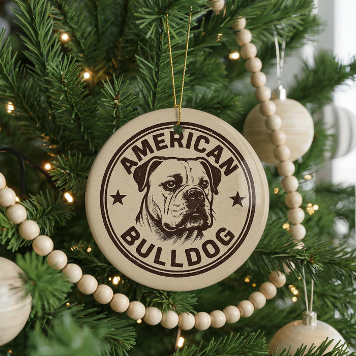A Christmas tree decorated with ornaments, including a circular ornament with the text "AMERICAN BULLDOG" and a bulldog image.