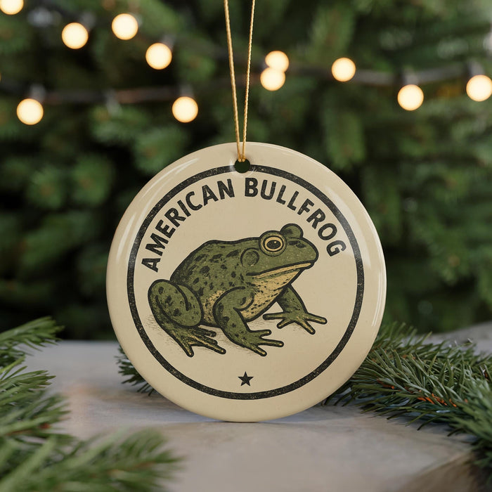A circular ornament featuring an illustration of an American bullfrog, with the text "AMERICAN BULLFROG" printed on it.