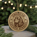 A circular ornament featuring an illustration of a cocker spaniel dog, with the text "AMERICAN COCKER SPANIEL" printed on it.