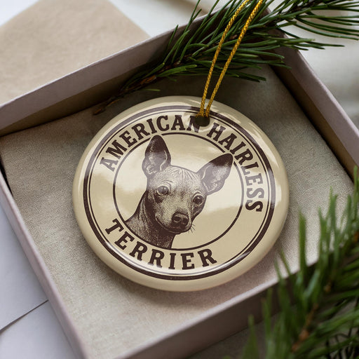 A circular ornament featuring a close-up image of a terrier dog's head, with the text "AMERICAN HAIRLESS TERRIER" printed on it.
