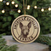 A circular ornament featuring an illustration of a terrier dog with the text "AMERICAN HAIRLESS TERRIER" on it.