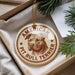 A circular ornament featuring a pit bull terrier dog's head, with the text "AMERICAN PIT BULL TERRIER" printed on it.
