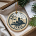 A decorative ornament with the text "ARLINGTON TEXAS U.S.A." printed on it, hanging from a string.