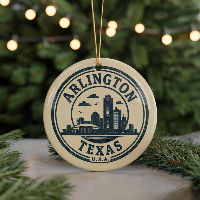 A circular ornament with the text "ARLINGTON TEXAS U.S.A." printed on it, featuring a graphic of a city skyline.