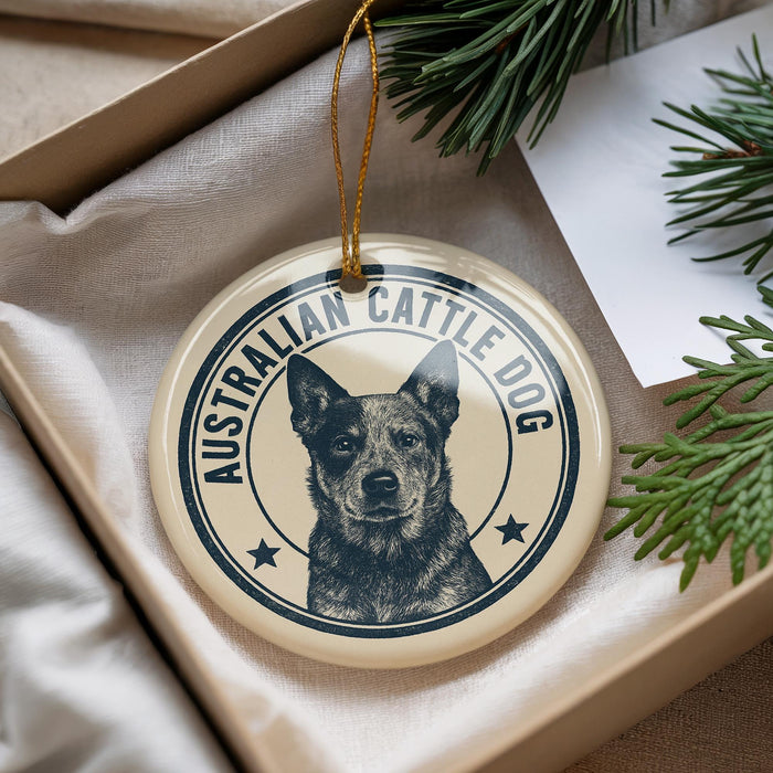 A circular ornament featuring an image of an Australian Cattle Dog, with the text "AUSTRALIAN CATTLE DOG" printed on it.