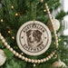 A Christmas tree decorated with ornaments, including a circular ornament with an image of an Australian Shepherd dog and the text "AUSTRALIAN SHEPHERD".