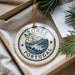 A circular ornament with the text "AZÓRES PORTUGAL" printed on it, surrounded by a landscape illustration.