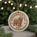 A round ornament with the text "BERGAMASCO DOG" and an illustration of a shaggy dog, hanging from a string.