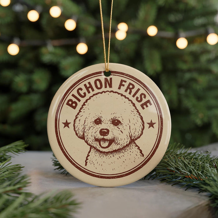A circular ornament featuring a poodle's face with the text "BICHON FRISE" around it, hanging from a string.