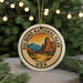 A circular ornament with the text "BIG BEND NATIONAL PARK USA" and an illustration of a mountain range, hanging from a string.