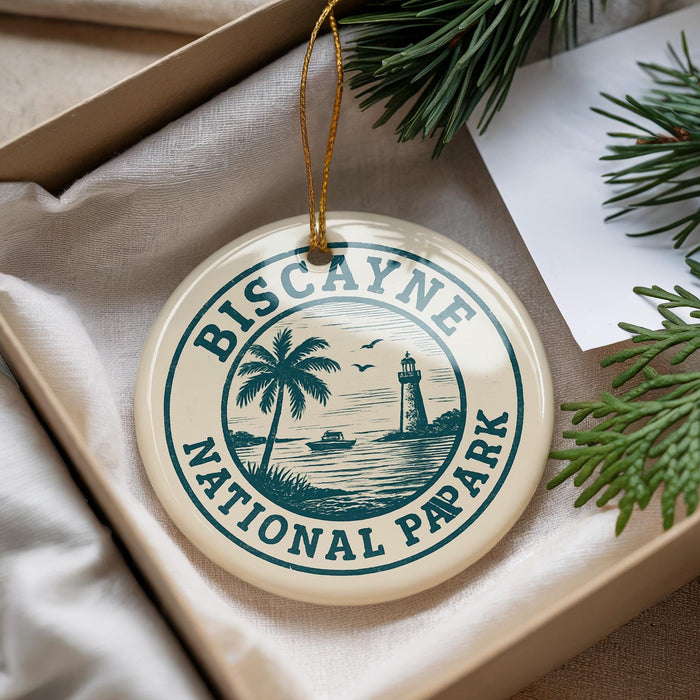 A circular ornament with the text "Biscayne National Pap Park" printed on it, hanging from a string.