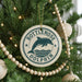 A Christmas tree decorated with ornaments, including a round ornament with a dolphin and the text "Bottlenose Dolphin".