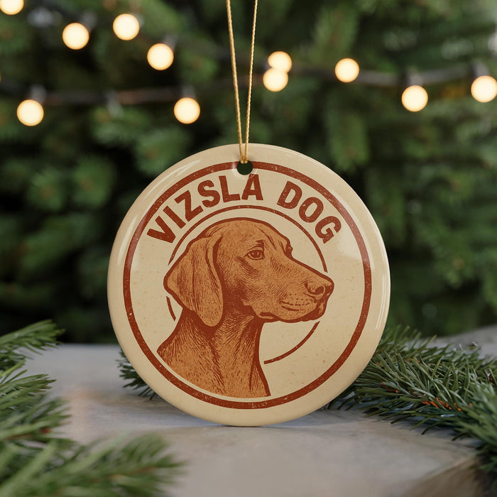 A circular ornament featuring a brown dog's head, with the text "Vizsla Dog" written around the edge.