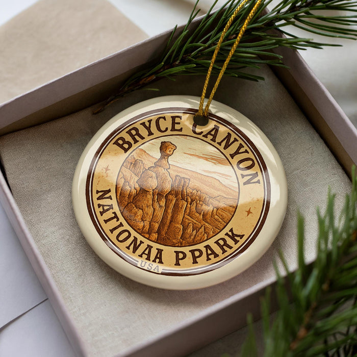 A circular ornament with the text "BRYCE CANYON NATIONAA P PARK" and an illustration of a person standing in front of a canyon.