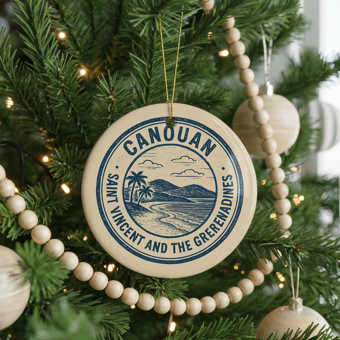 A Christmas tree decorated with ornaments, including a circular ornament with the text "CANOUAN SAINT VINCENT AND THE GREEMENADINES" and a palm tree illustration.