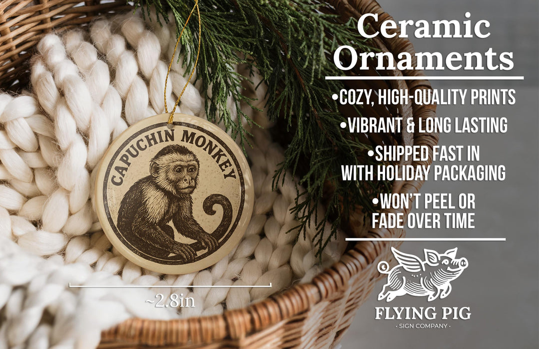 Ceramic ornaments featuring a monkey, with text describing the ornaments as "cozy, high-quality prints, vibrant and long lasting, shipped fast in with holiday packaging, won't peel or fade over time" and the company name "FLYING PIG - SIGN COMPANY".