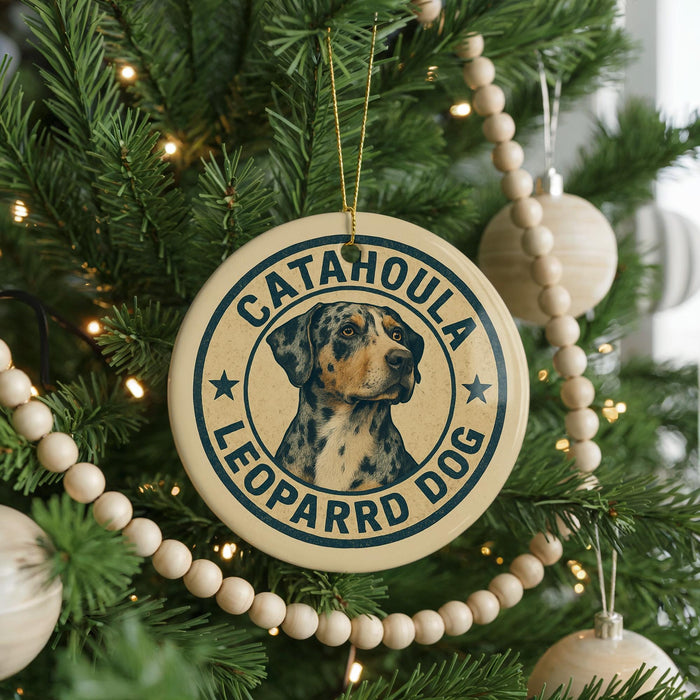 A Christmas tree decorated with ornaments, including a circular ornament with a leopard dog image and the text "CATAHOULA LEOPARD DOG".