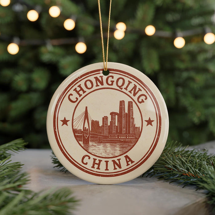 A circular ornament with the text "CHONGQING CHINA" and an illustration of a city skyline, hanging from a string.