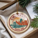 A decorative ornament featuring the Cincinnati skyline, with a bridge and the text "CINCINNATI, OHIO, USA" prominently displayed.