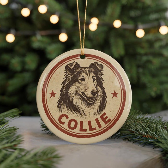 A round ornament featuring a collie dog's head, with the name "COLLEIE" written below it, is hanging from a string.
