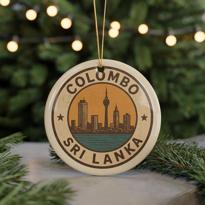 A circular ornament with the text "COLOMBO SRI LANKA" and an illustration of a city skyline, hanging from a string.
