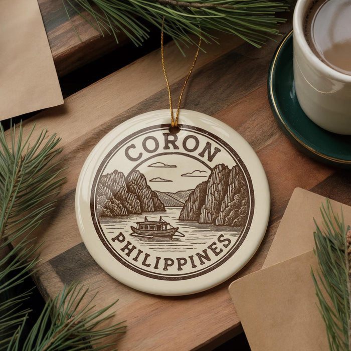 A decorative ornament with the text "CORON PHILIPPINES" and an illustration of a boat on a lake, surrounded by pine branches and a cup of coffee.