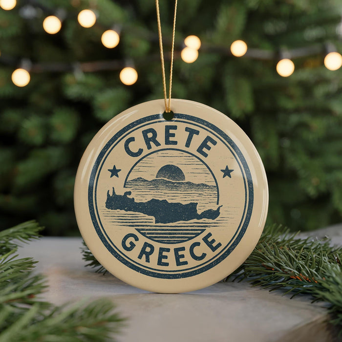 A circular ornament with the text "CRETE GREECE" and a graphic of a map of Crete, Greece, is hanging from a string.