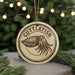 A round ornament with the word "CUTTLEFISH" printed on it, featuring an illustration of an octopus.