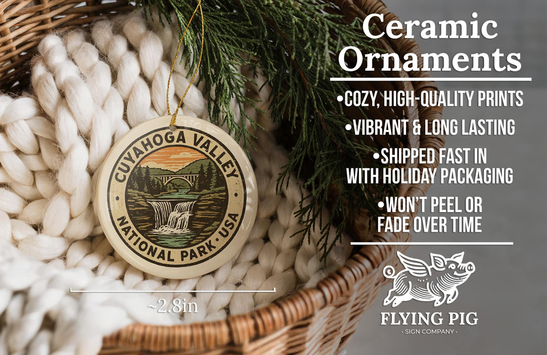 Ceramic ornaments, featuring a ceramic ornament with a waterfall and national park seal, are displayed in a woven basket.