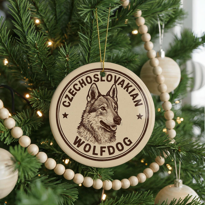 A round ornament with a picture of a wolf dog on it, hanging on a Christmas tree.